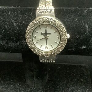 Elegant Silver Tone Watch with Intricate Design
